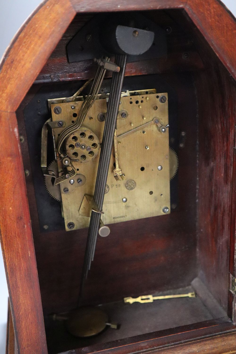 A Victorian mahogany and cut brass chiming lancet mantel clock, 6 inch silvered dial and French musical movement striking on five pipes